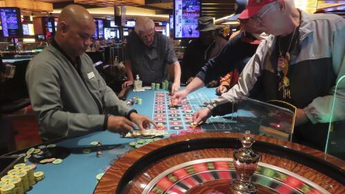 A croupier conducts a game of roulette at the Tropicana casino in Atlantic City, NJ on May 12, 2022. New Jersey casinos, racetracks that accept sports bets and their online partners won $462.7 million in April, with a 9.5% increase over the previous year.  This figure includes internet winnings and sports betting operations.  But the amount won on-premise by land-based casinos fell 1.6% to $231.4 million.  (AP Photo/Wayne Parry)